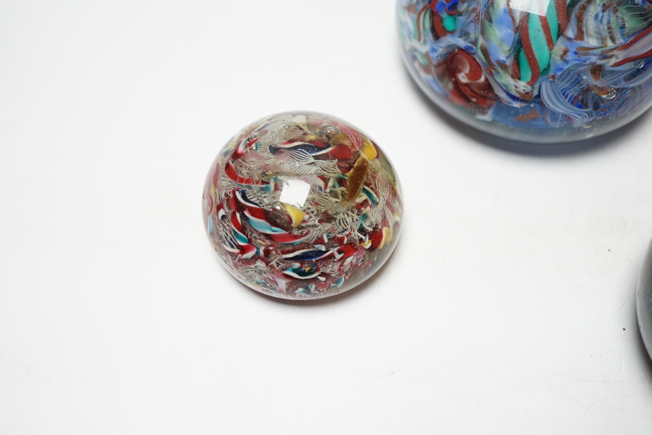 Three 19th century Venetian scrambled glass paperweights, largest 8.5cm